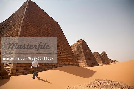 Sudan, Begrawiya. A tourist explores the ancient Nubian Pyramids.