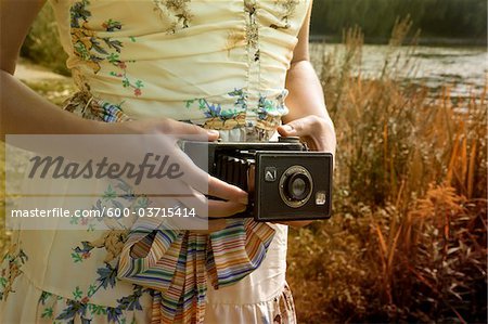 Woman Holding Folding Camera, High Park, Toronto, Ontario, Canada