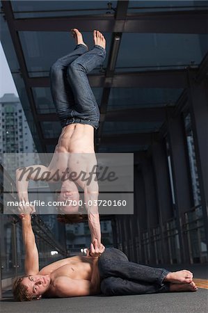 Two Acrobats Performing Outside, Taipa, Macau, China