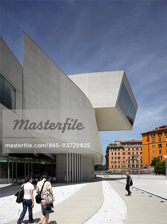 The MAXXI, National Museum of 21st Century Arts, Rome. Exterior with visitors walking to entrance. Architects: Zaha Hadid Architects