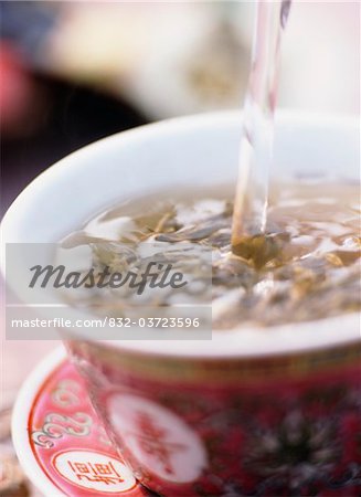 Tea being poured into tea cup, Close Up