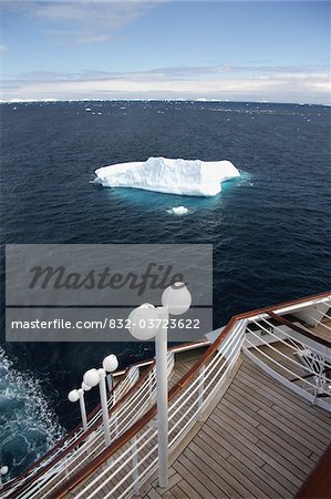 View of iceberg from bow of cruise ship