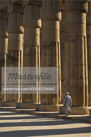 Temple guard walking past columns in Court of Amenophis III