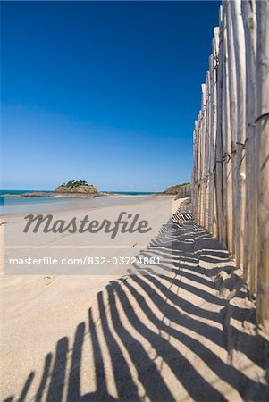 Looking along fence beside beach to the Fort du Guesclin, Low Angle View