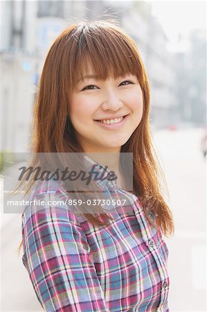 Young Asian Woman in City