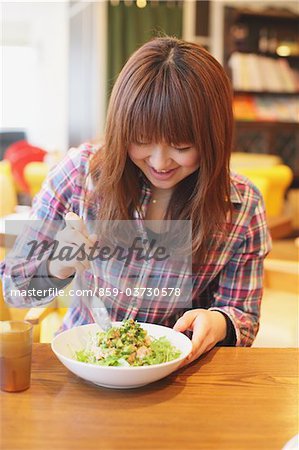 Woman Enjoying Lunch In Cafe