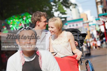 Young Couple Sitting In Rickshaw In Asakusa, Japan