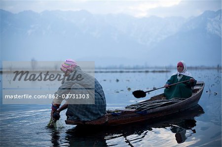 Locals on Dal Lake at Srinagar, Kashmir, India