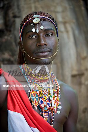 Kenya, Laikipia, Lewa Downs.  A Laikipiak Maasai warrior or moran in traditional dress.