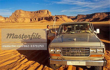 Libya; Fezzan; Jebel Akakus. A 4WD pauses in the wilds of Wadi Teshuinat in the Jebel Akakus.