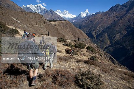 Nepal, Everest Region, Khumbu Valley, Namche Bazaar. Trekkers head towards Mount Everest in the far distance for Base Camp