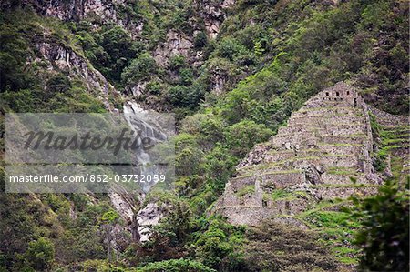 Peru, The Inca ruins at Choq esuysuy are sited adjacent to a stream that tumbles down steep mountains from Phuyupatamarka.