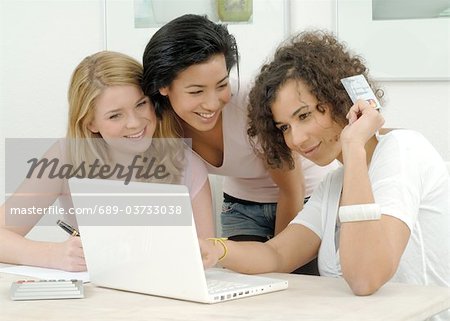 Three friends online shopping