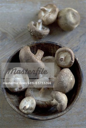 Shiitake mushrooms in wooden bowl