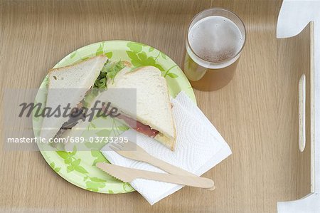 Two sandwiches and glass of beer Two sandwiches and glass of beer