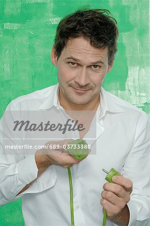 Man holding green plug