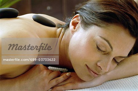 Woman receiving Lastone therapy