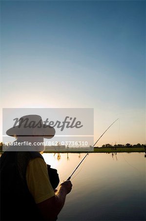 Australia, Northern Territory, Kakadu National Park, Cooinda. Fly fishing for Barramundi at the Yellow Water Wetlands. (PR)