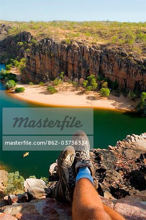 Australia, Northern Territory, Nitmiluk National Park.  Hiker relaxing with a view across Katherine Gorge.