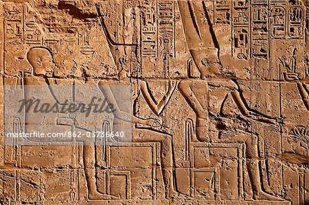 Egypt, Qina, Luxor, Al Karnak, Detailed stone carving in the Shrine of Seti II in the Karnak Temple Complex.