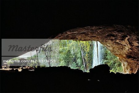 Kenya. The entrance to Kitum Cave on Mount Elgon where elephants come at night to dig for mineral salt.
