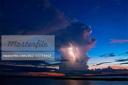 Kenya, Nyanza District. A violent evening storm with forked lightning over Lake Victoria .