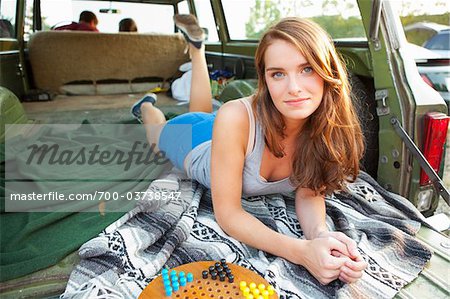 Teenage Girl Lying Down in Back of Car