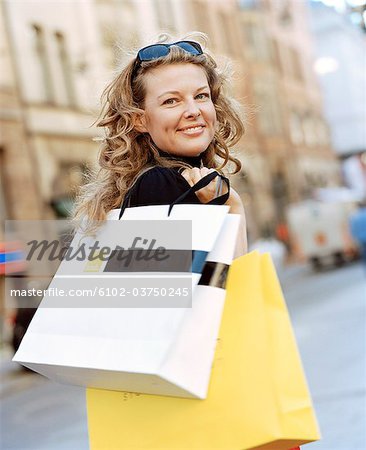 A woman with shopping bags.