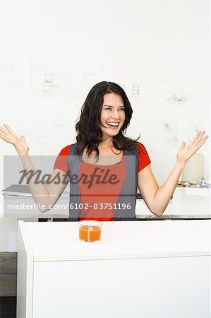 A smiling woman in an office.