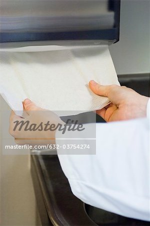 Taking paper towel from dispenser