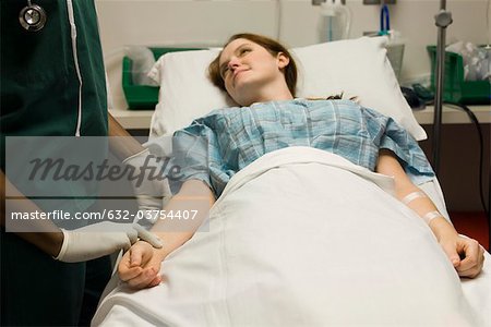 Nurse checking patient's pulse