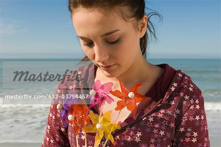 Preteen girl with pinwheels, portrait