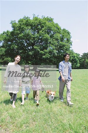 Japanese Family Having Fun In a Park