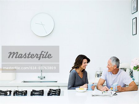 Mature couple having breakfast