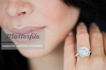 Young woman wearing engagement ring