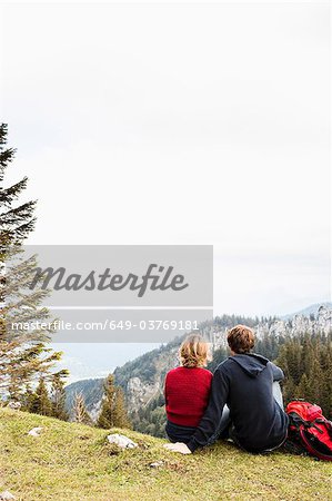 Couple resting on mountain