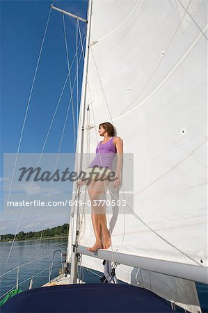 Girl standing in sail