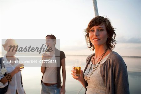 Girls drinking beer on boat