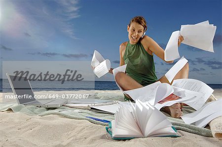 Woman working on beach