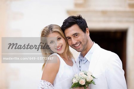 Bridal couple in front of church