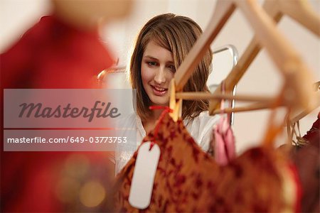 Young lady fascinated in fashion store