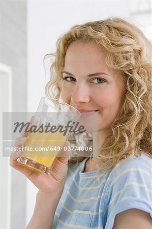 Woman drinking orange juice