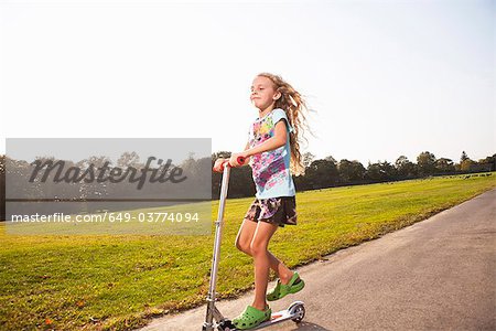 Girl riding scooter