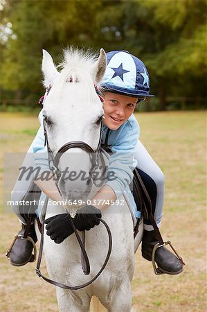 Young girl with pony