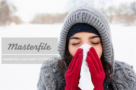 Woman using tissue