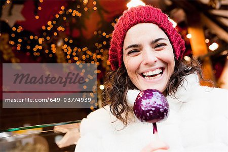 Woman holding candied apple