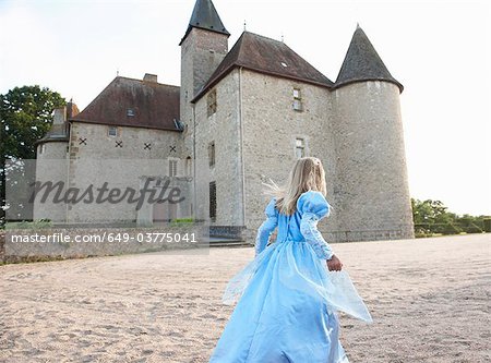 Girl as a princess infront of castle