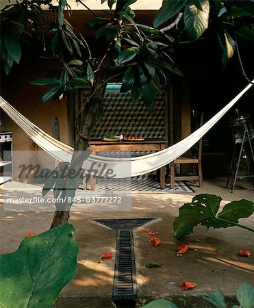 Jungle House, Tepotzlan. Outdoor kitchen area with hammock. Architects: Sergio Puente and Ada Dewes