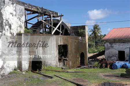 Grenada. Dilapidated wheelhouse and agricultural buildings