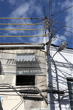 Grenada. Detail of telephone wires, cables and street lamp.